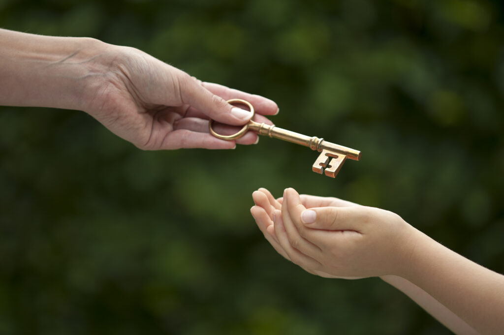 adult hands key to child